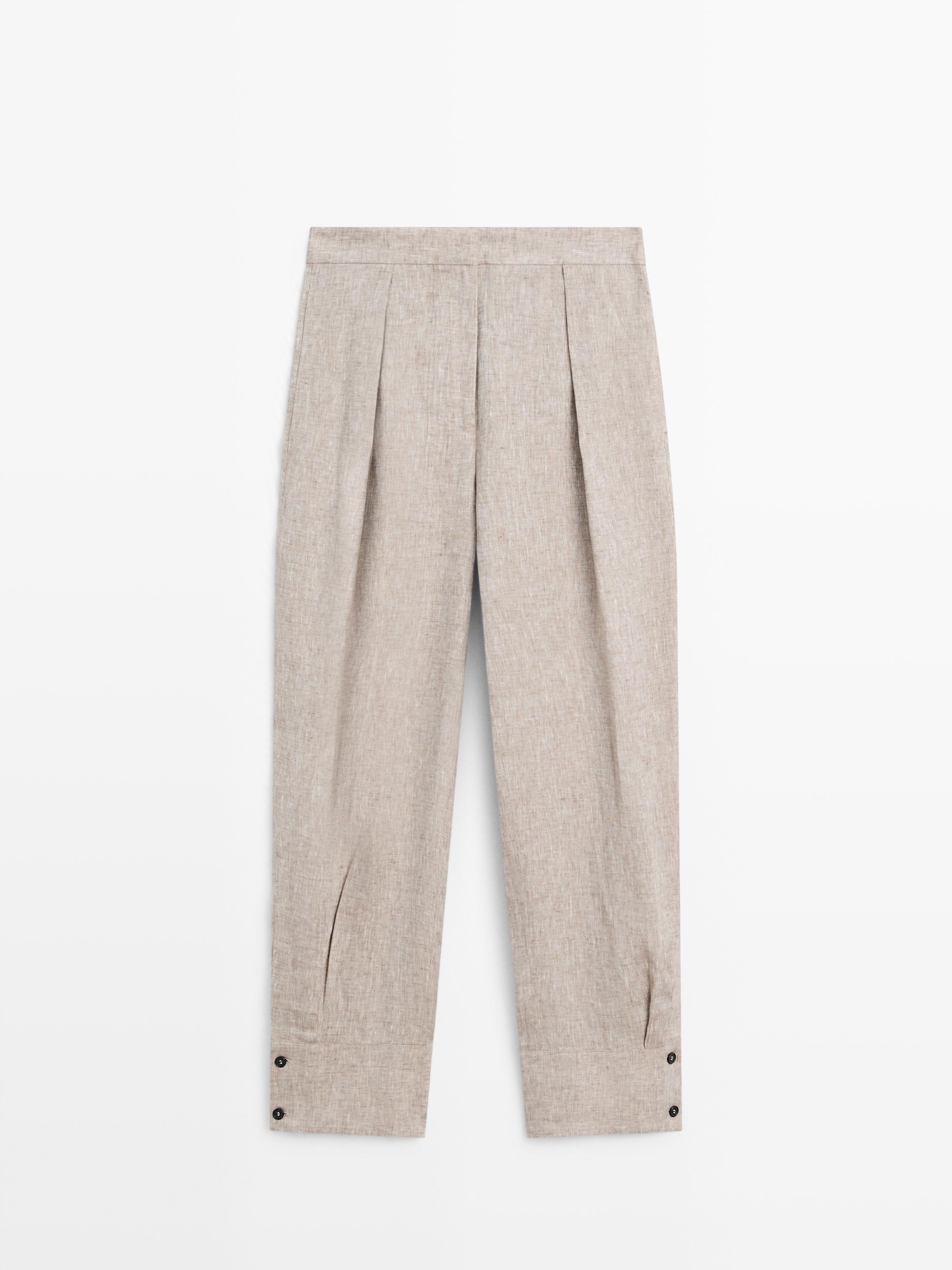 Suit trousers with buckle detail